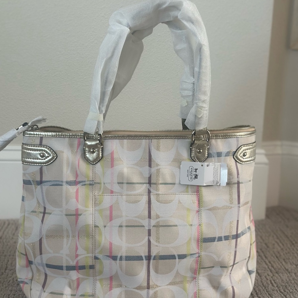 Spring into Spring with this Coach White Signature Multicolor Stripe Tote